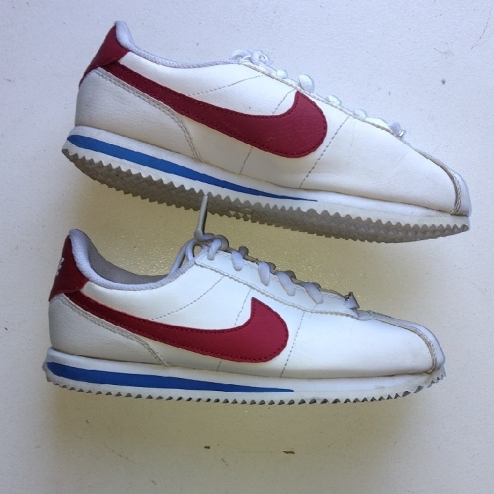 Nike White Sneakers with Red Swoosh and Blue Accent
